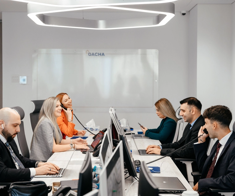 Dacha Real Estate Team Working collaboratively in Office  - undefined